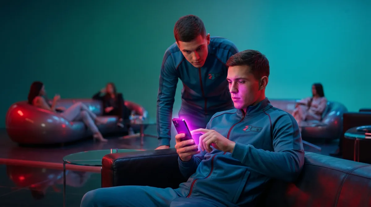 Two 22Bet users placing a bet from a phone