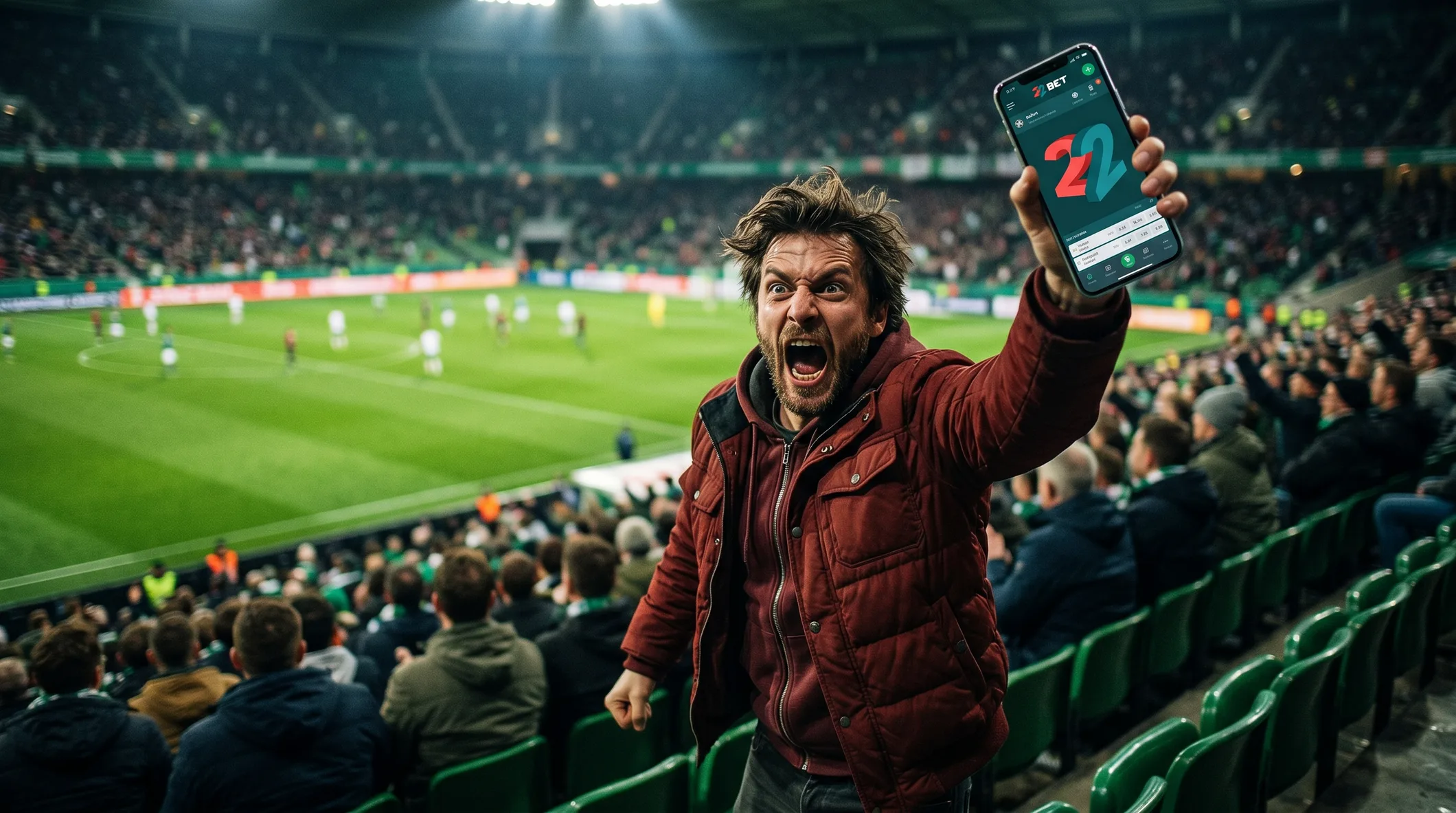 A 22Bet fan in the stand following a match on his phone